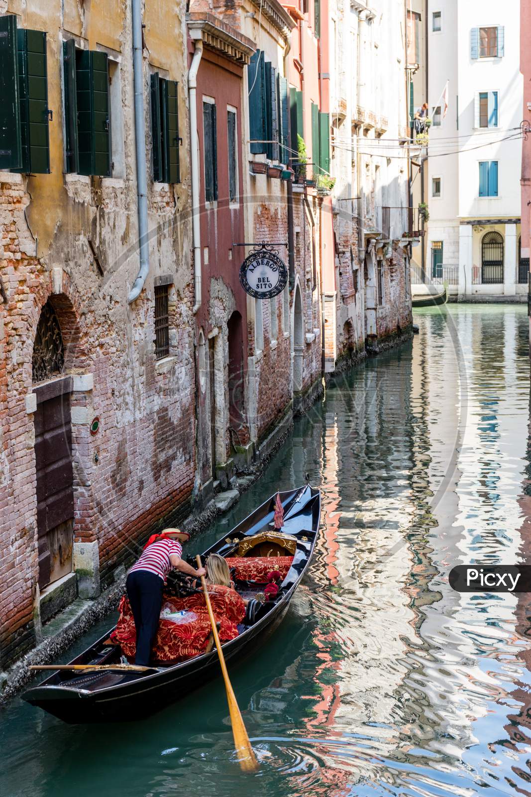 Venice, Italy - 01 July 2018: The Gondolas On A Canal In Venice, Italy