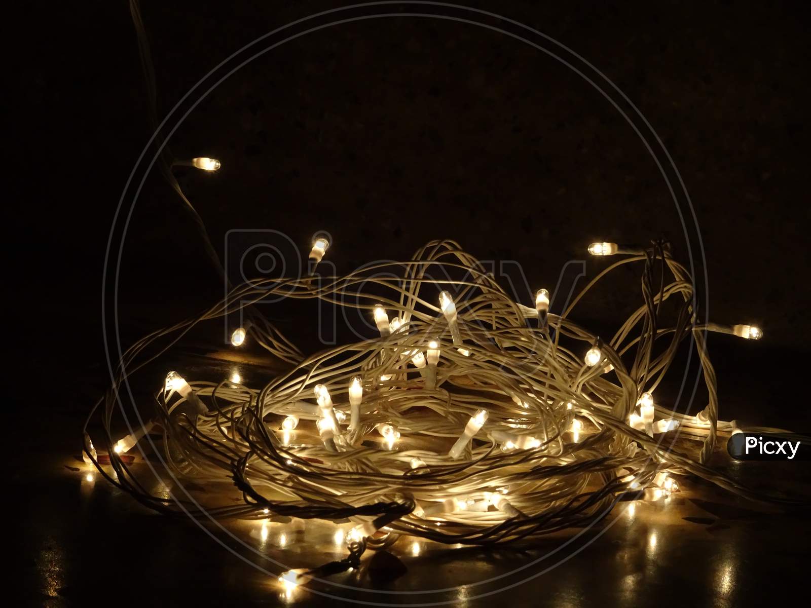 Beautiful sparkling yellow white tiny lights in night with dark background