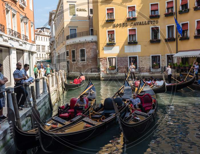 Venice, Italy - 01 July 2018: The  Gondola Station On Canal In Venice, Italy Near Zara And Hotel Cavalletto