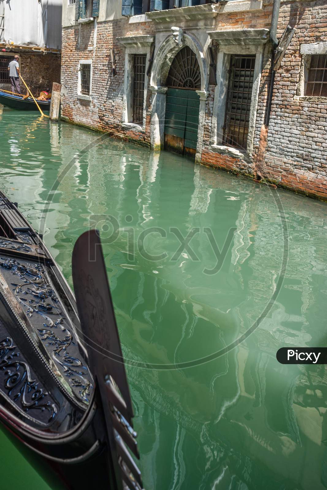 Gondola Boat On The Canals Of Venice, Italy