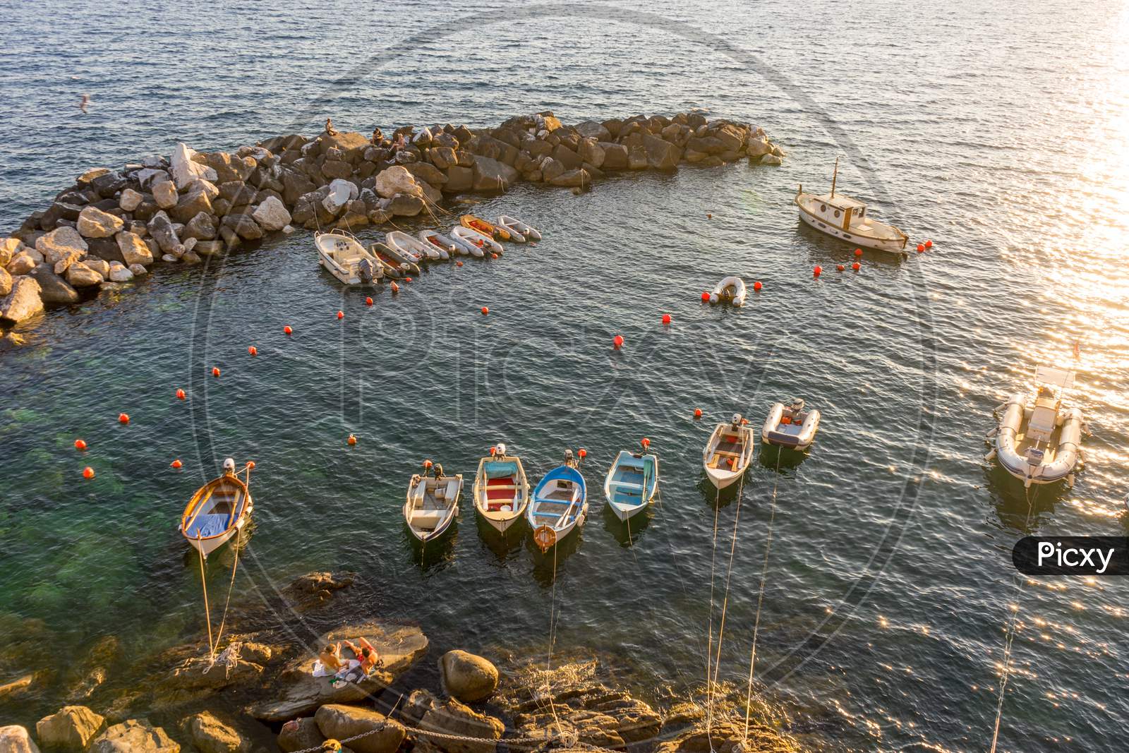 Boats And Yachts On The Ocean During Sunset, Italian Riviera Of Riomaggiore, Cinque Terre, Italy