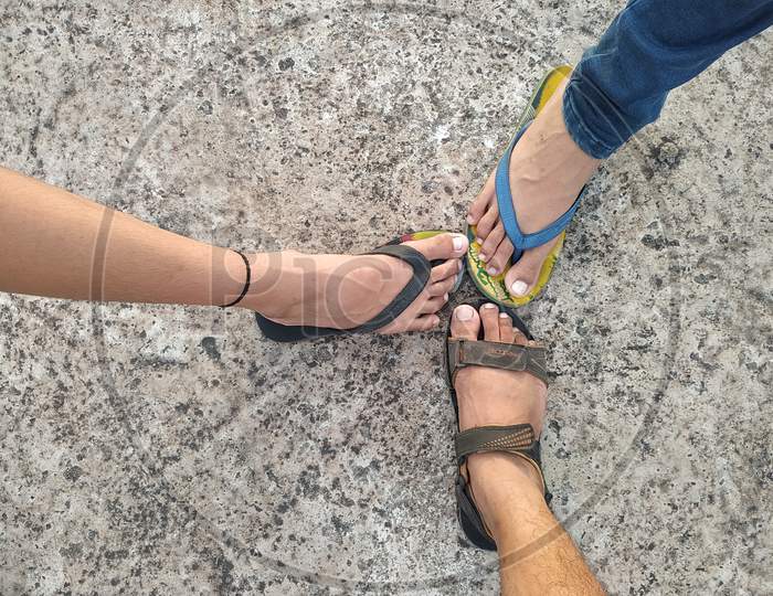 Three feets together showing friendship