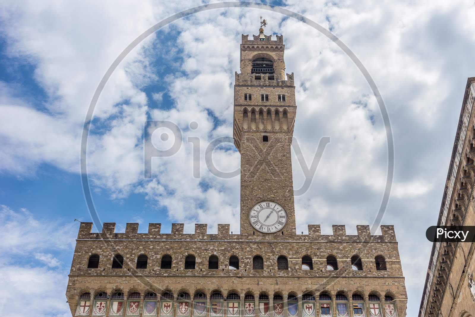 Italy,Florence, Palazzo Vecchio, A Large Tall Tower With A Clock At The Top Of Palazzo Vecchio
