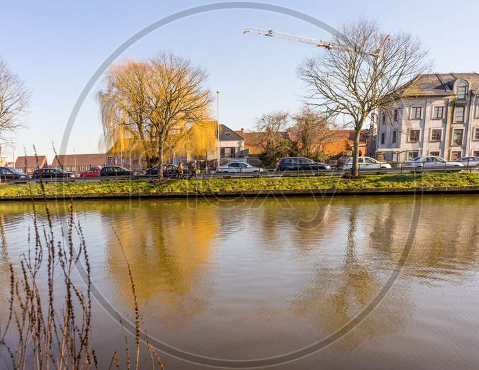 Bruges, Belgium - 17 February 2018: People Walking By A Canal In Brugge/Bruges Belgium