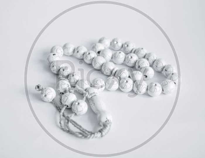 white prayer beads isolate on white background