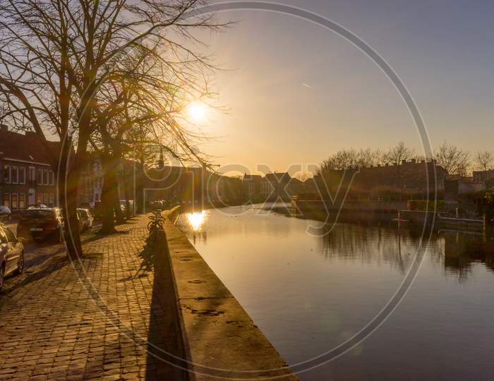 Bruges, Belgium - 17 February 2018: Sunset Over A Canal In Bruges, Belgium