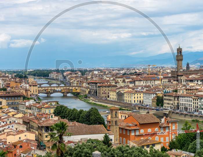 Panaromic View Of Florence Townscape Cityscape Viewed From Piazzale Michelangelo (Michelangelo Square) With Ponte Vecchio And Palazzo Vecchio