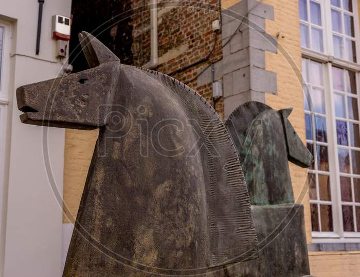 Belgium, Bruges, A Horse That Is Standing In Front Of A Building