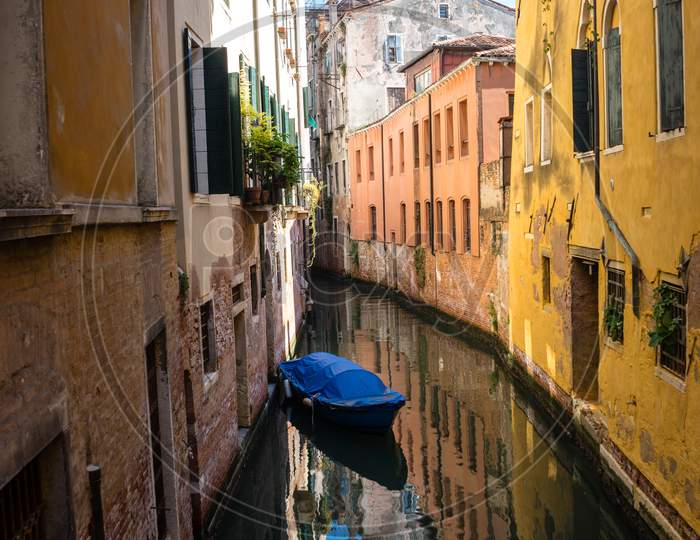 Italy, Venice, Italy, Canal Amidst Buildings Against Clear Sky