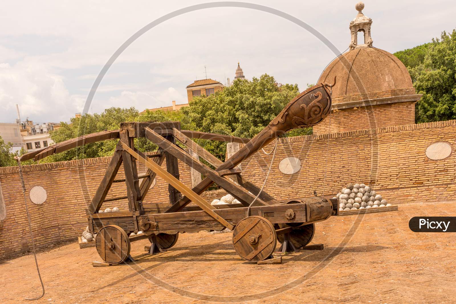 Rome, Italy - 23 June 2018: Ancient Catapult Weapon With Cannon Balls At The Castel Sant Angelo, Mausoleum Of Hadrian In Rome, Italy