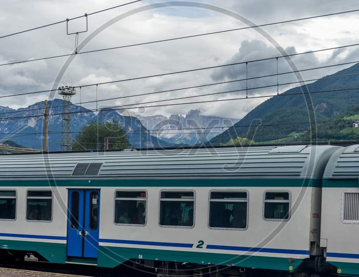 Bolzano, Italy - 28 June 2018: The Bolzano Railway Station With The Dolomites In The Background, Italy