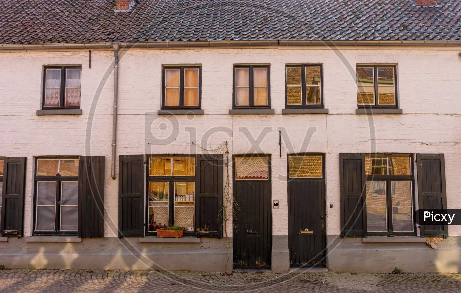 Belgium, Bruges, A Store Front Of A House