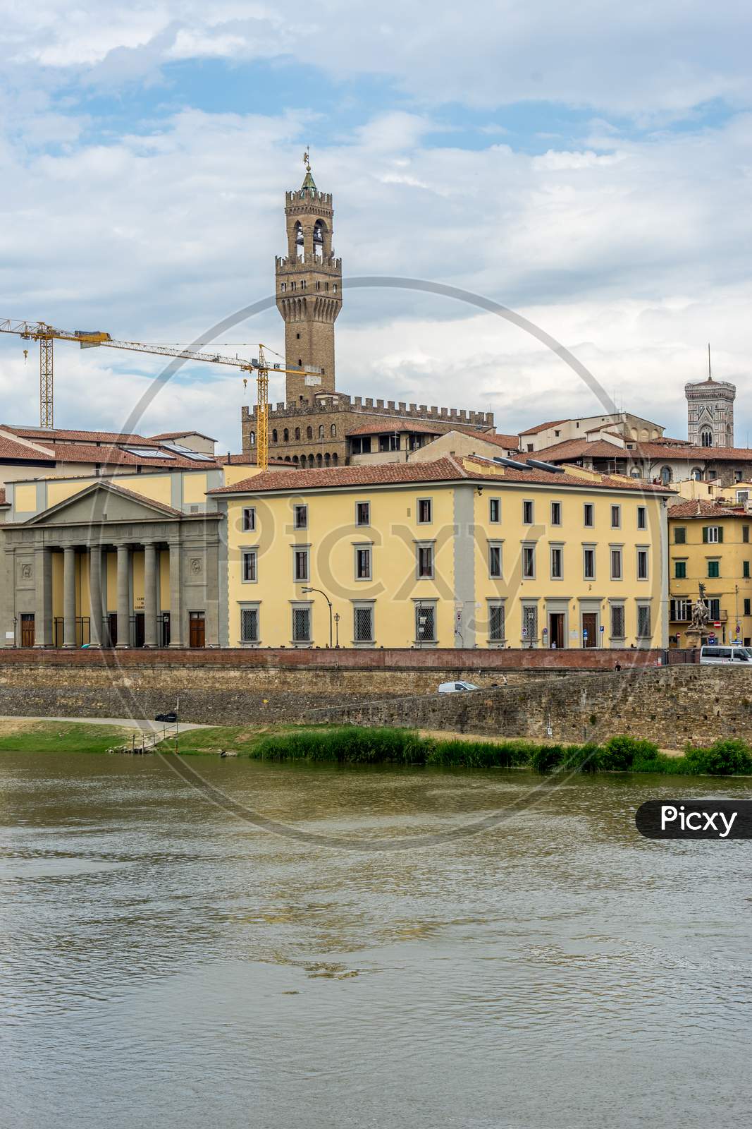 Florence, Italy - 25 June 2018: The Palazzo Vecchio Over The Arno River In Florence, Italy