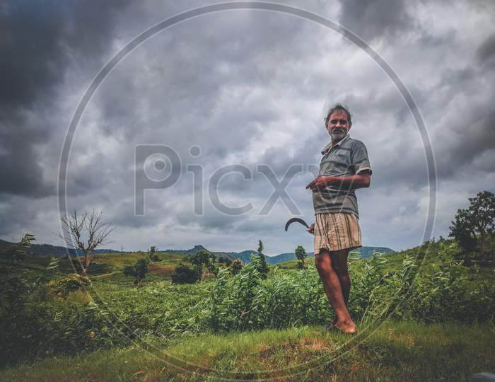 Farmer in Moody sky,rainy clouds
