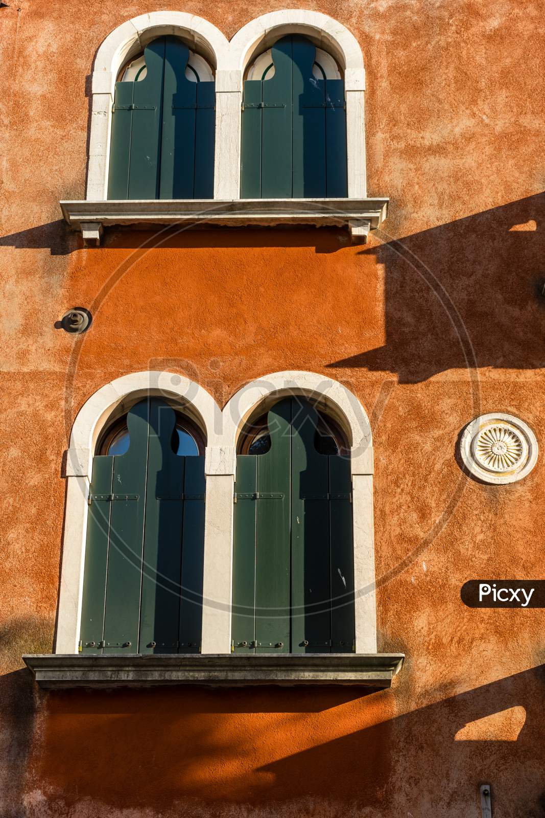 Italy, Venice, Window Arch On A Red Building