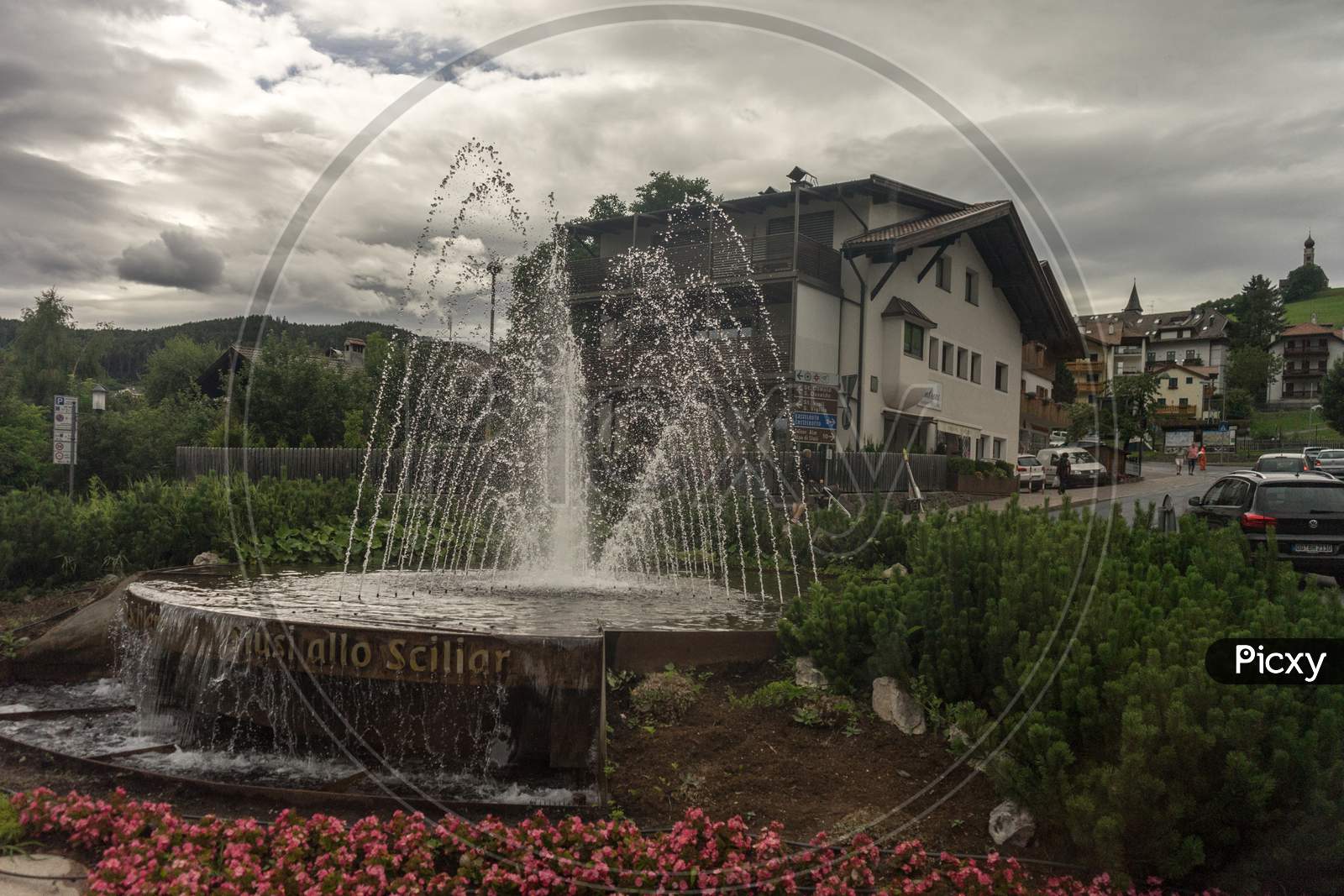 Italy - 28 June 2018: The Water Fountain At Siusi Allo Sciliar In Kastelruth, Italy