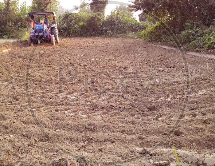 Agriculture in India tractor working in the form