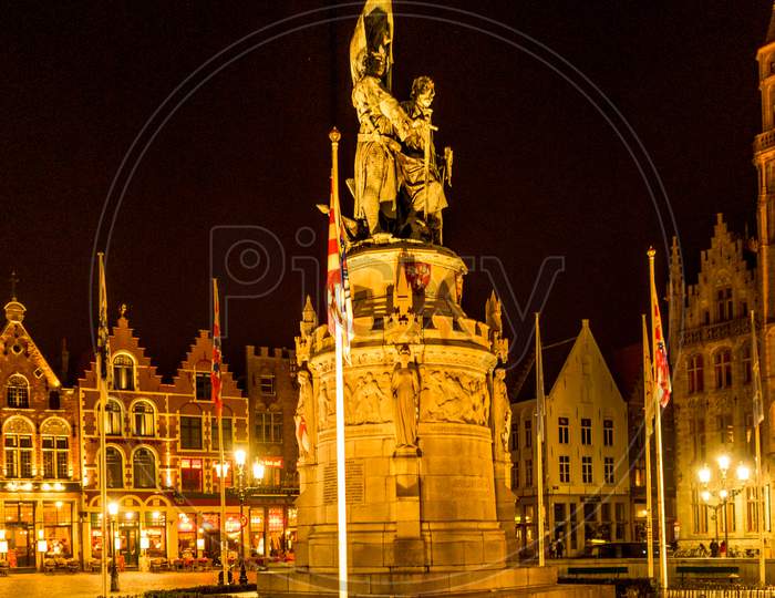 Belgium, Bruges, A Large Building Lit Up At Night