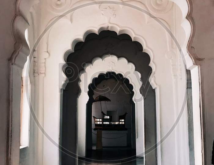 A hallway of a fort with white walls