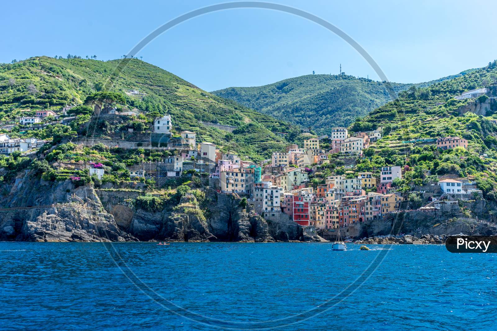 The Cityscape Of Riomaggiore Viewed From The Sea, Cinque Terre, Italy, Riviera