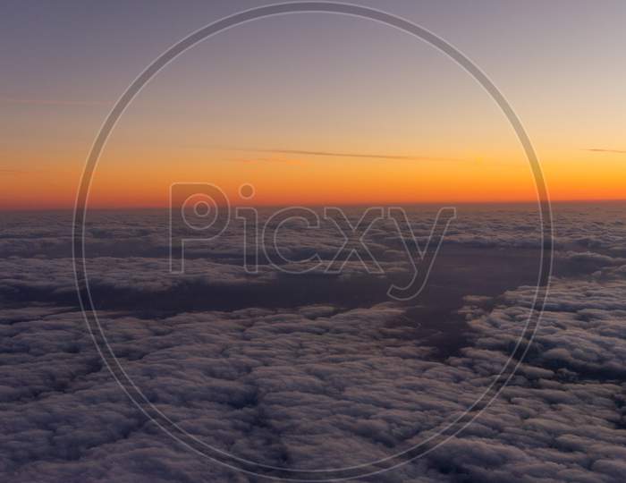 Netherlands, A Sunset Over A Body Of Clouds