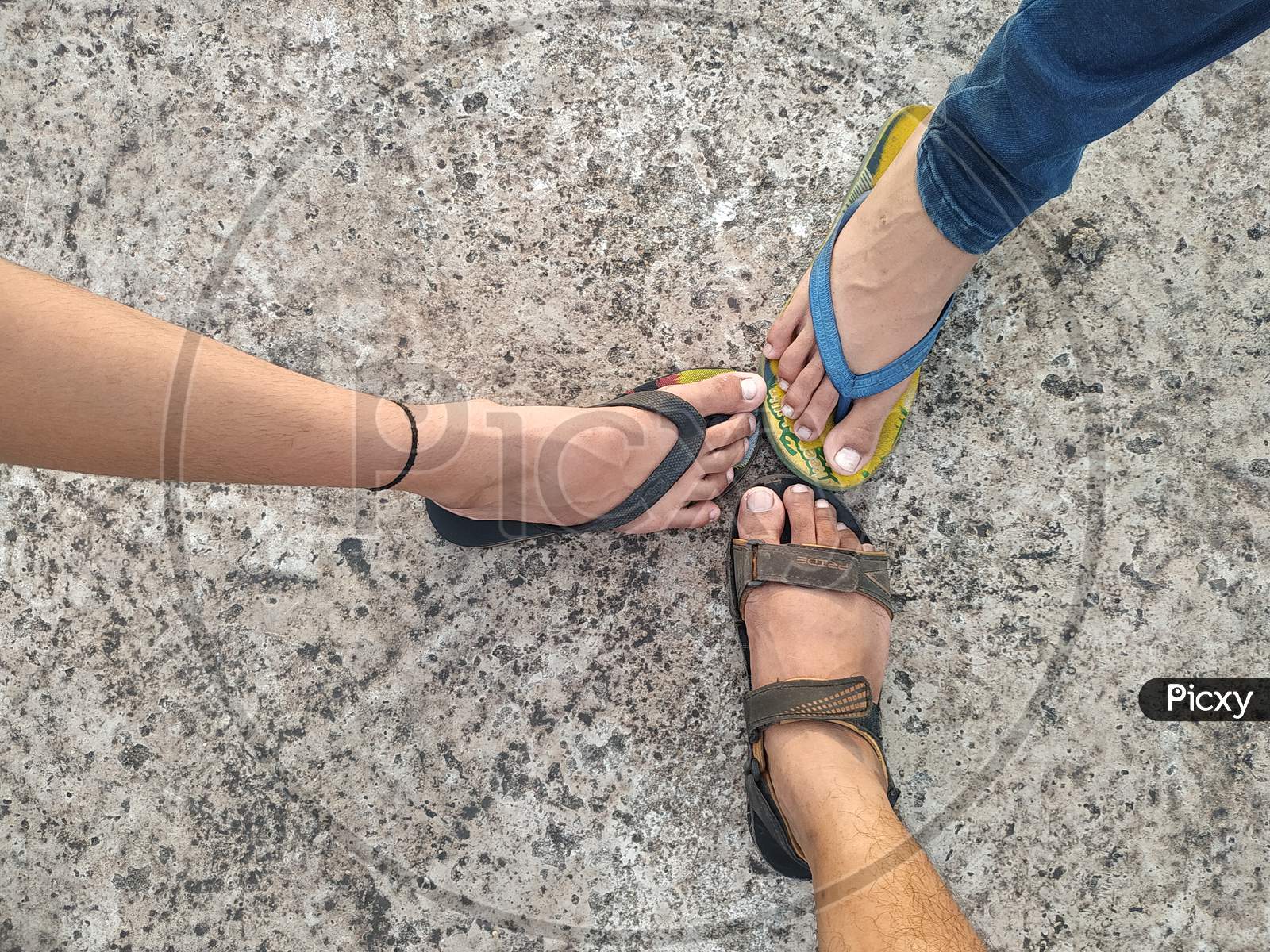 Three feets together showing friendship