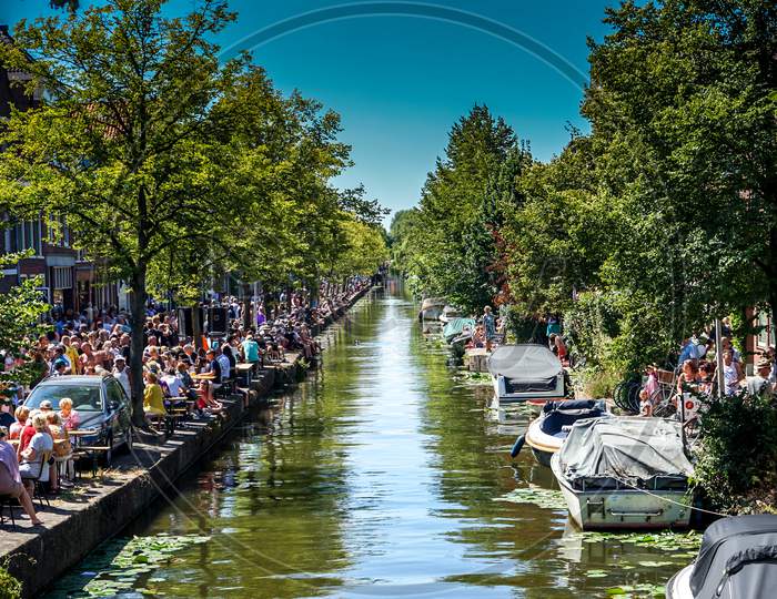Netherlands, Delft - 5Th August 2018: A Group Of People On A Boat In The Water