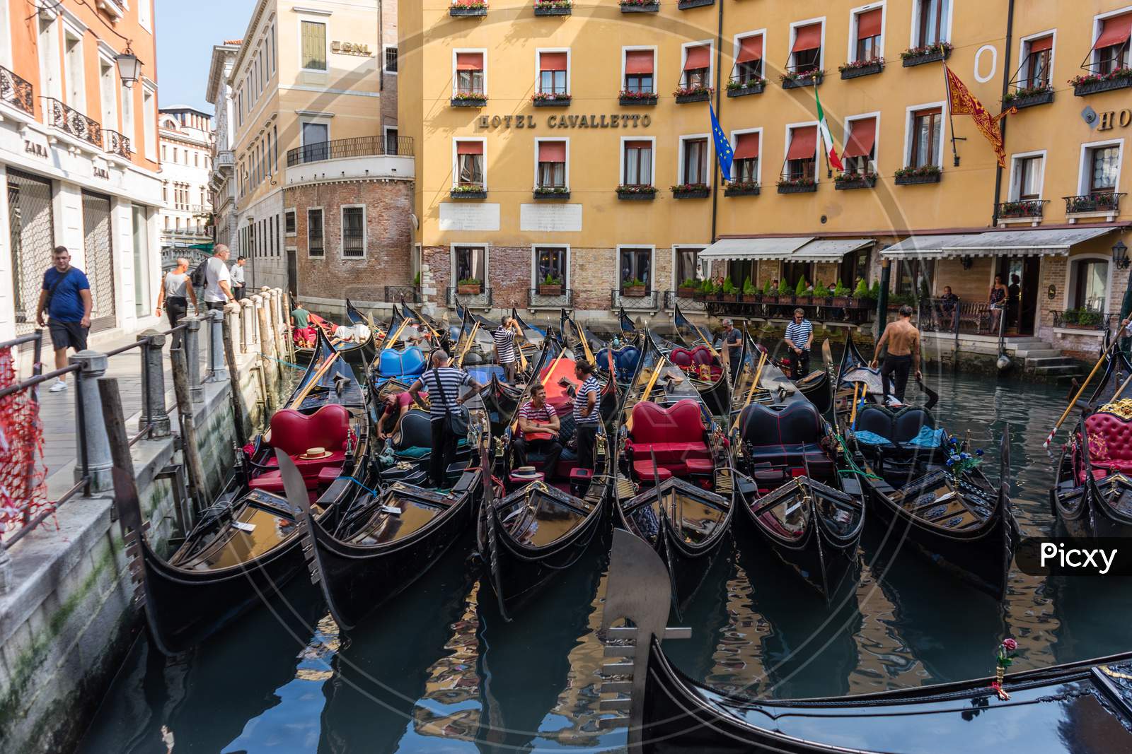 Venice, Italy - 01 July 2018: The  Gondola Station On Canal In Venice, Italy Near Zara And Hotel Cavalletto