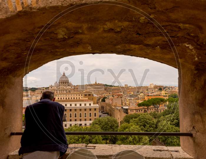 Rome, Italy - 23 June 2018: A Person Looking At Saint Peter'S Church From A Balcony In Rome, Italy