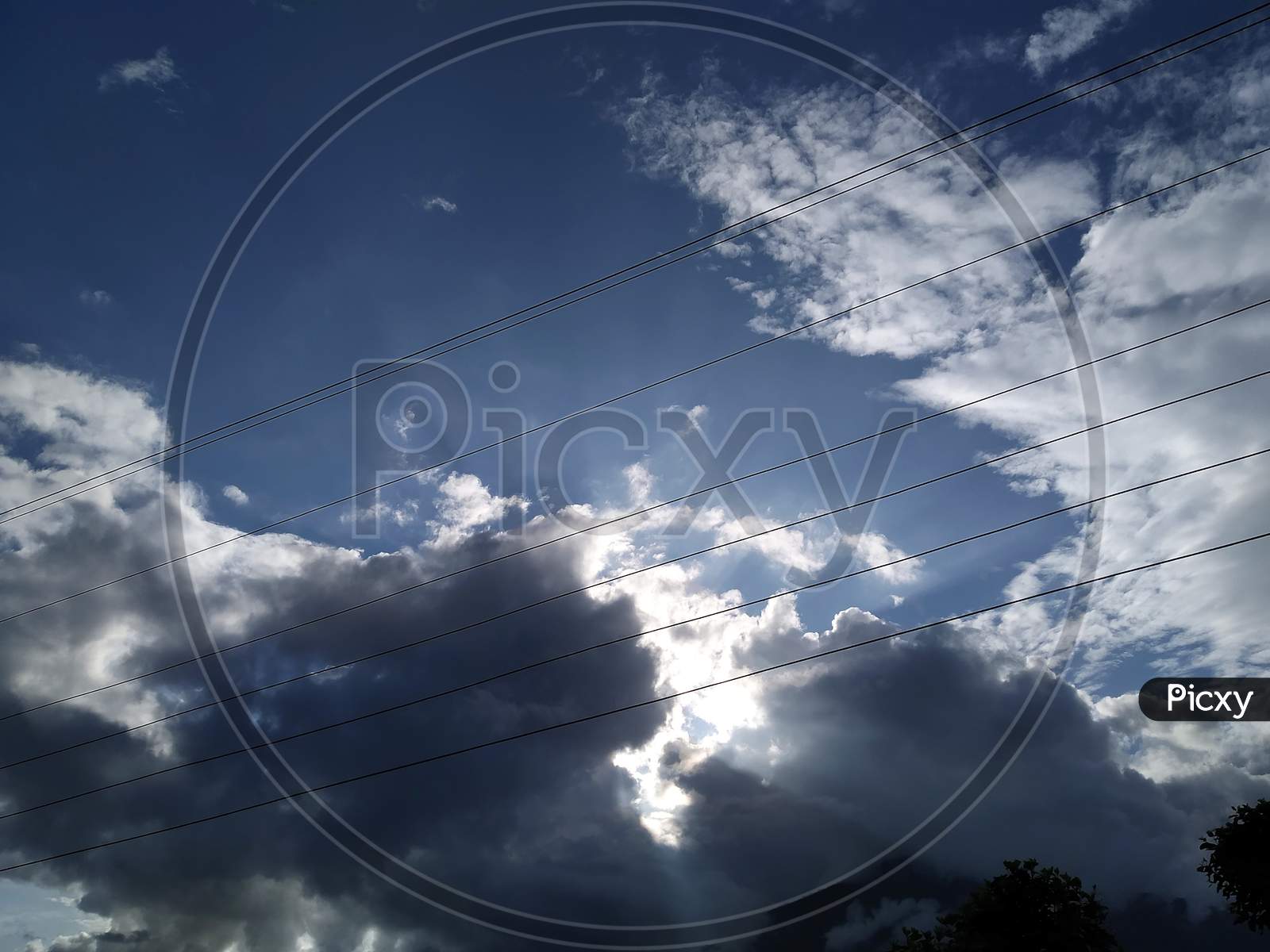 Image of Clouds blocking the sun in a mid sunny summer day-HC915215-Picxy