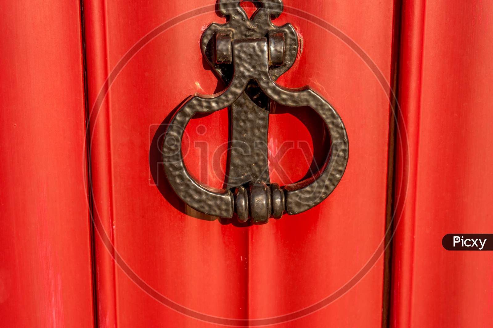 Belgium, Bruges, A Close Up Of A Red Door With A Metal Latch