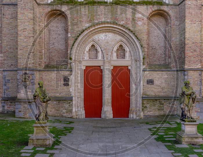 Belgium, Bruges, Sint, Red Door Under An Arch