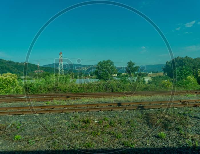 Italy,La Spezia To Kasltelruth Train, A Large Green Field With Trees In The Background