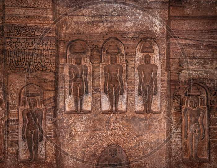 Cave Sculptures Of Jain Gods Carved On Walls Ancient Stone Art In Details