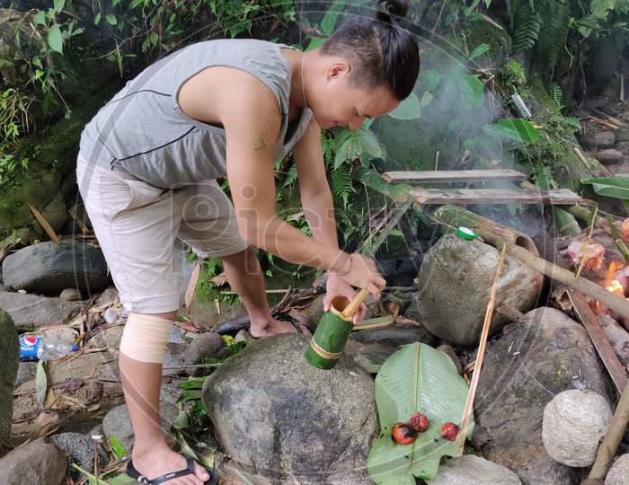 Making chatni in Bamboo tubes in jungle of Arunachal Pradesh