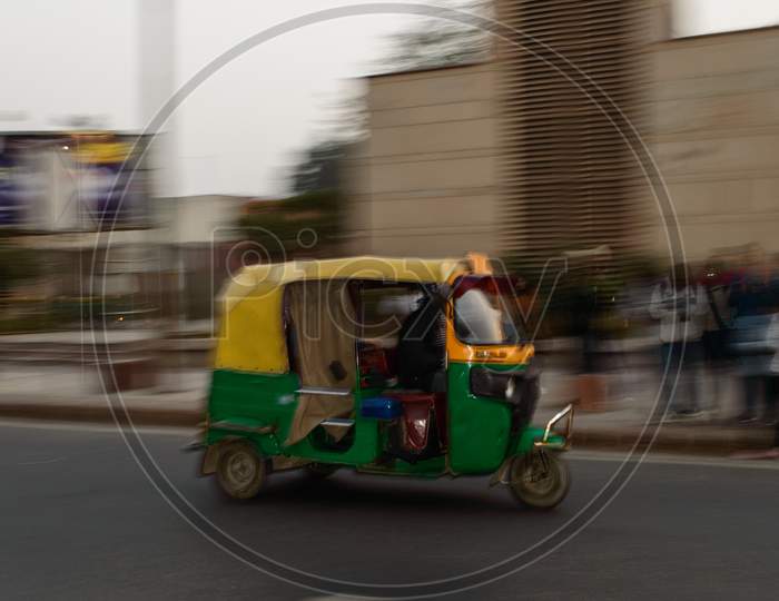 Panning Technique Of Indian Auto Rickshaw Going Somewhere At Evening With Passenger