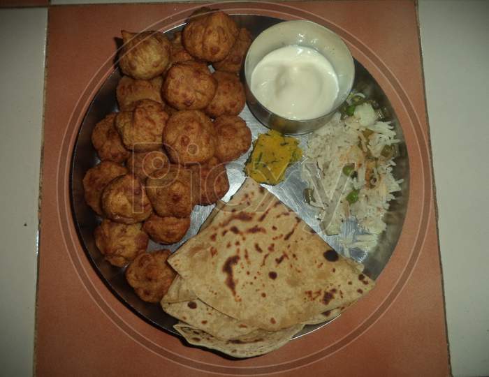 maharastrian meal plate with modak and chapati