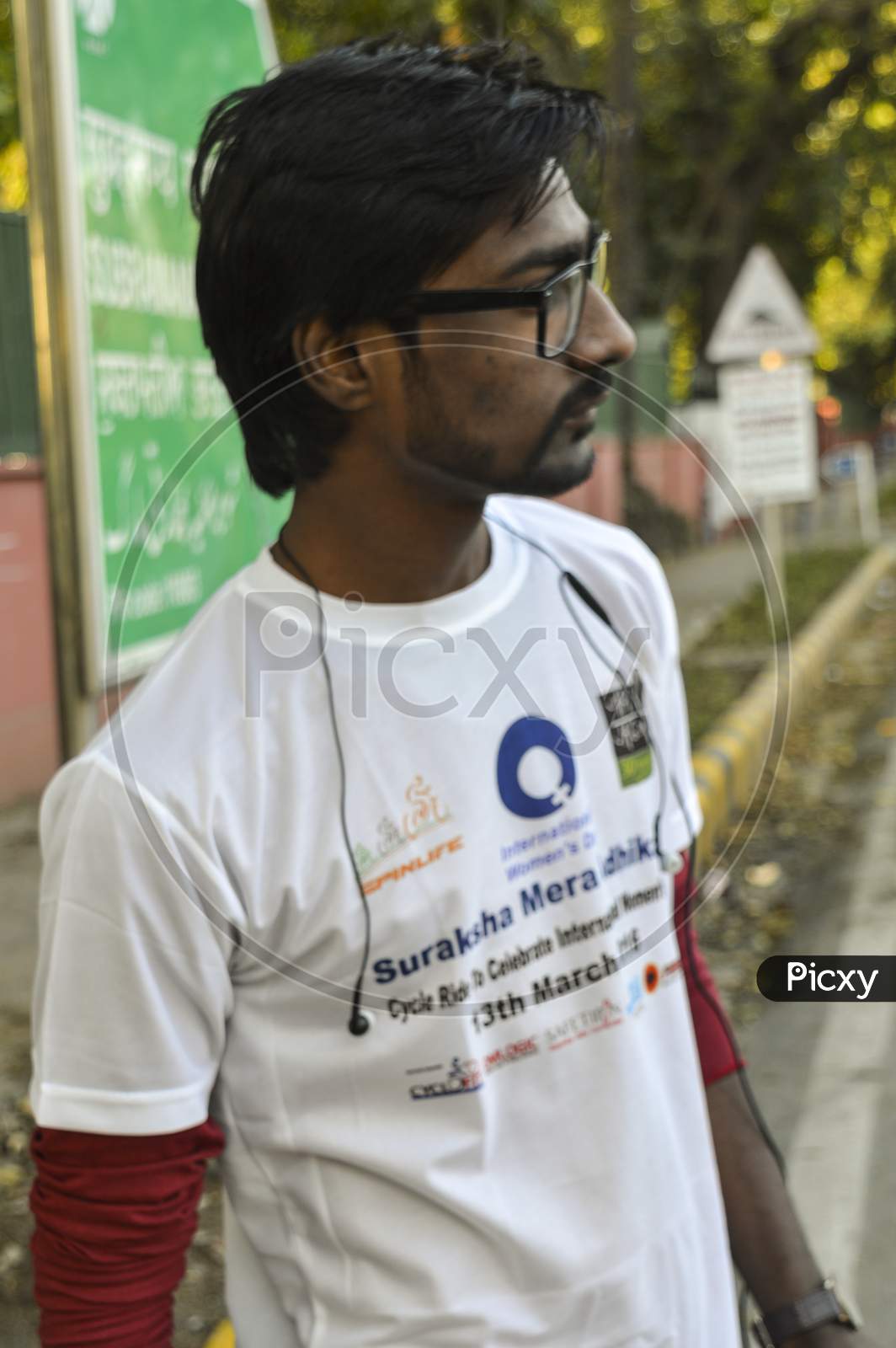A Indian Boy Poses For Support The Cycle Ride To Celebrate International Women'S Day.