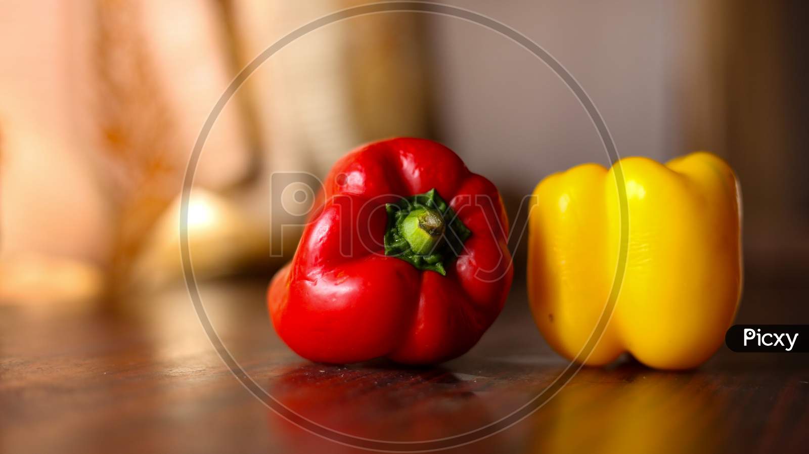 Closeup View Of Red And Yellow Color Bell Peppers In A Clean Background