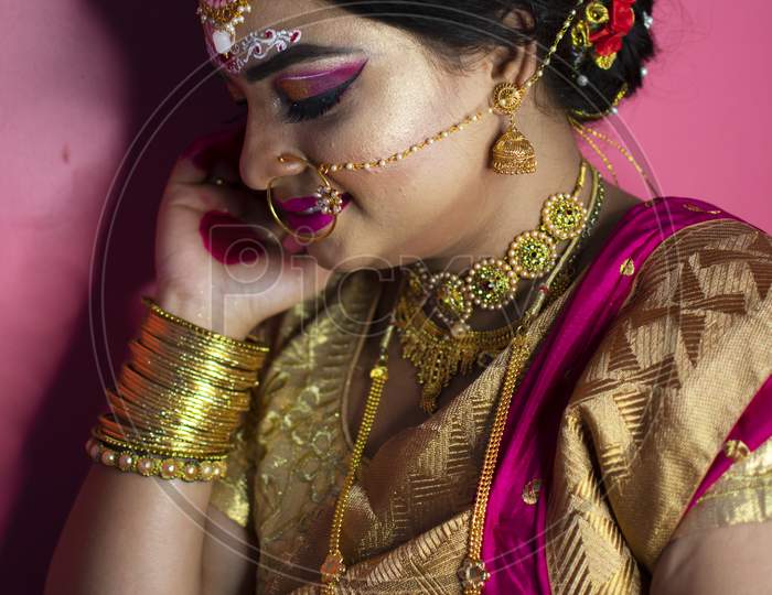 Portrait Of Beautiful Woman With Bright Bridal Makeup And Jewellery