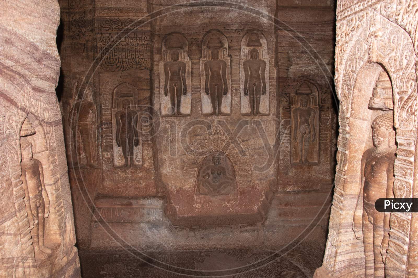 Cave Sculptures Of Jain Gods Carved On Walls Ancient Stone Art In Details