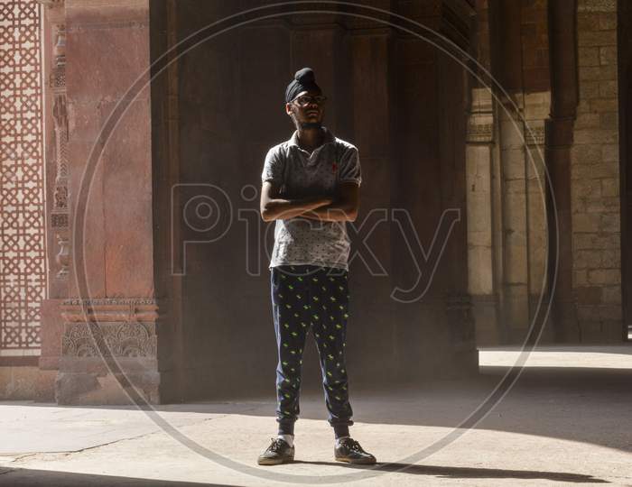 A Indian Boy Giving Pose For Fashion Shoot Inside Of Old Fort.