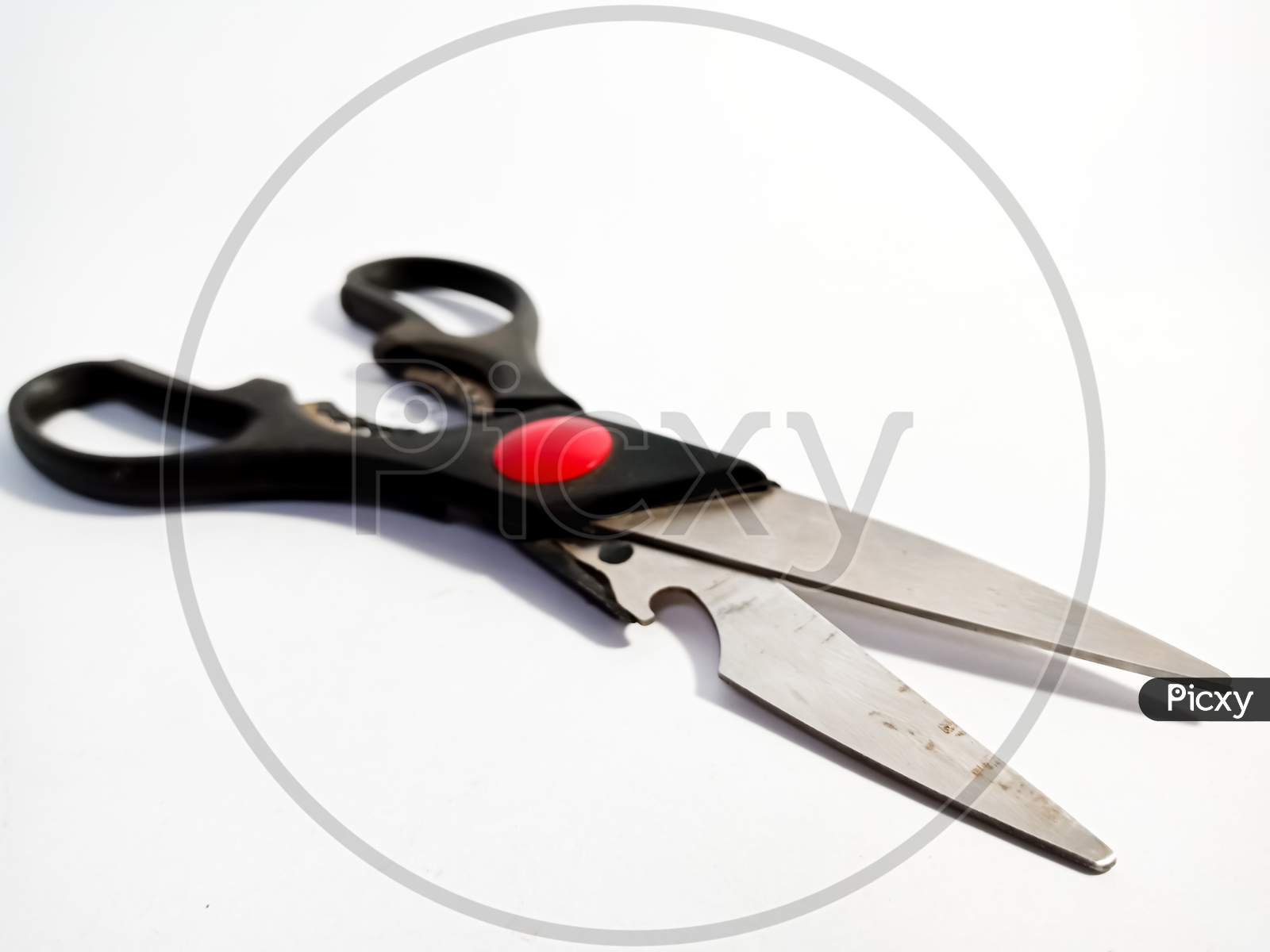 Scissors Isolated On White Background For Marketing And Branding Promotional Purpose Background.