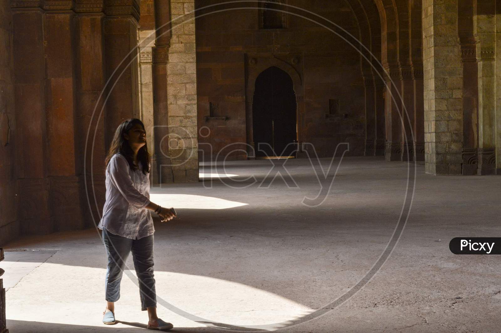 A Indian Girl Giving Pose For Fashion Shoot Inside Of Old Fort.