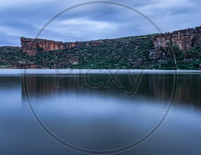 Lake Pristine With Mountain Background And Bright Sky Long Exposure Shot At Dusk