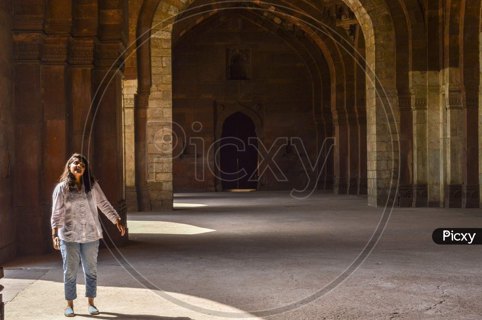 A Indian Girl Giving Pose For Fashion Shoot Inside Of Old Fort.