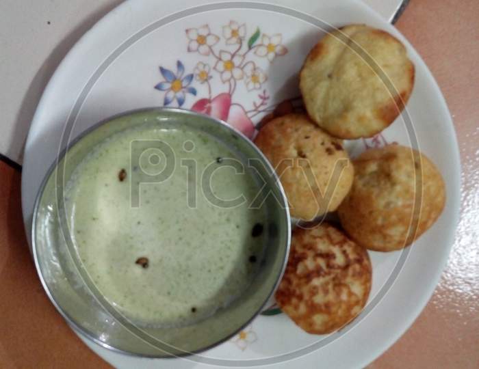appe and coconut chutney in plastic plate
