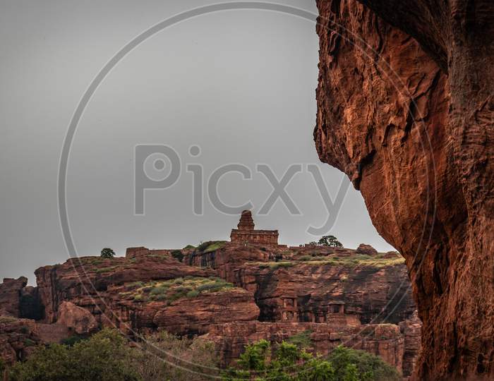 Badami Cave Upper Shivalaya Temple With Mountain Foreground