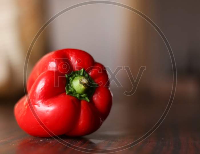 Closeup View Of Red Color Bell Pepper In A Clean Background