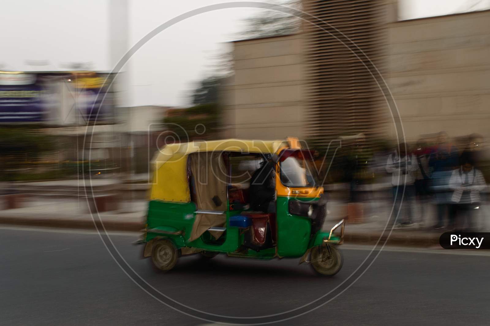 Panning Technique Of Indian Auto Rickshaw Going Somewhere At Evening With Passenger